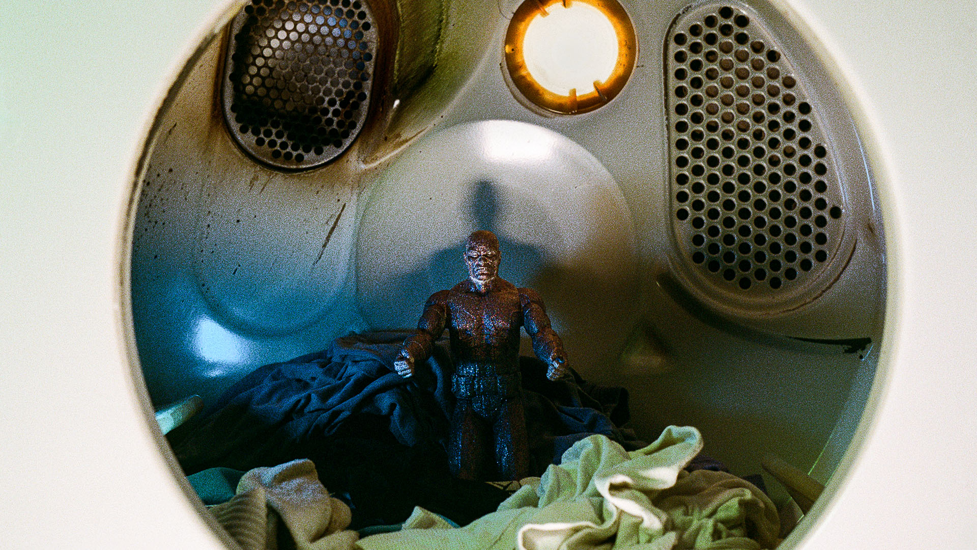 Action figure in dryer.